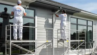 Professional gutter painting on North Shore home in Highland Park, IL by expert house painters